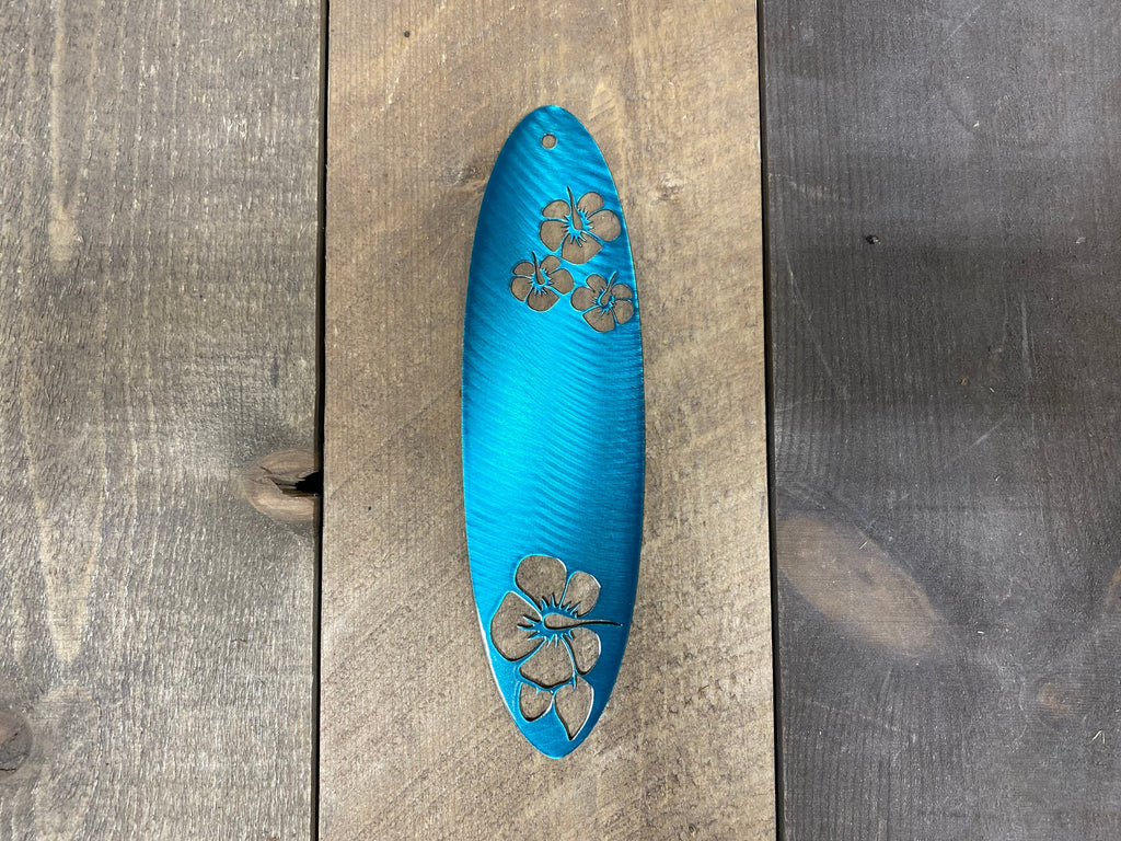 Colorful CNC-cut metal surfboard wall art featuring vibrant powder-coated finish for beach house and coastal home decoration