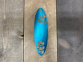 Colorful CNC-cut metal surfboard wall art featuring vibrant powder-coated finish for beach house and coastal home decoration