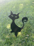 Black powder-coated metal silhouette of a curious sitting cat with an 8-inch ground stake for Halloween yard decoration