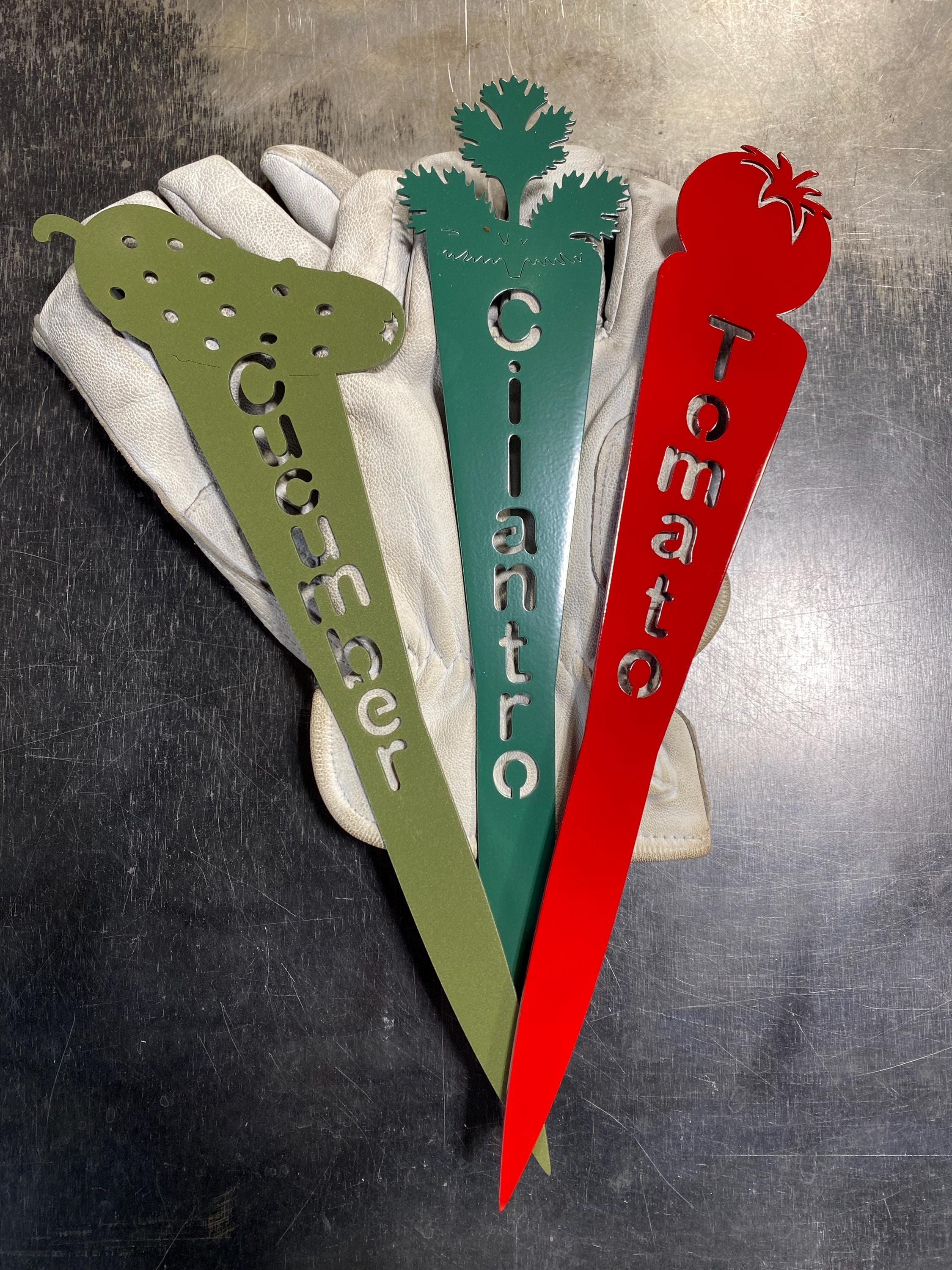 Metal vegetable garden plant marker stake featuring laser-cut vegetable design with vertical plant name text in powder-coated steel finish